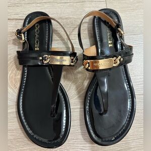 Coach Black Leather T-Strap Sandals w/ Gold Logo Plate – Women’s